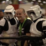 A fan poses with storm troopers
