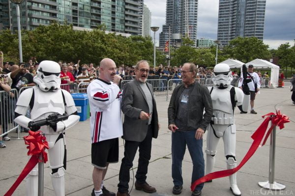 The ribbon cutting ceremony with Englund and Henriksen