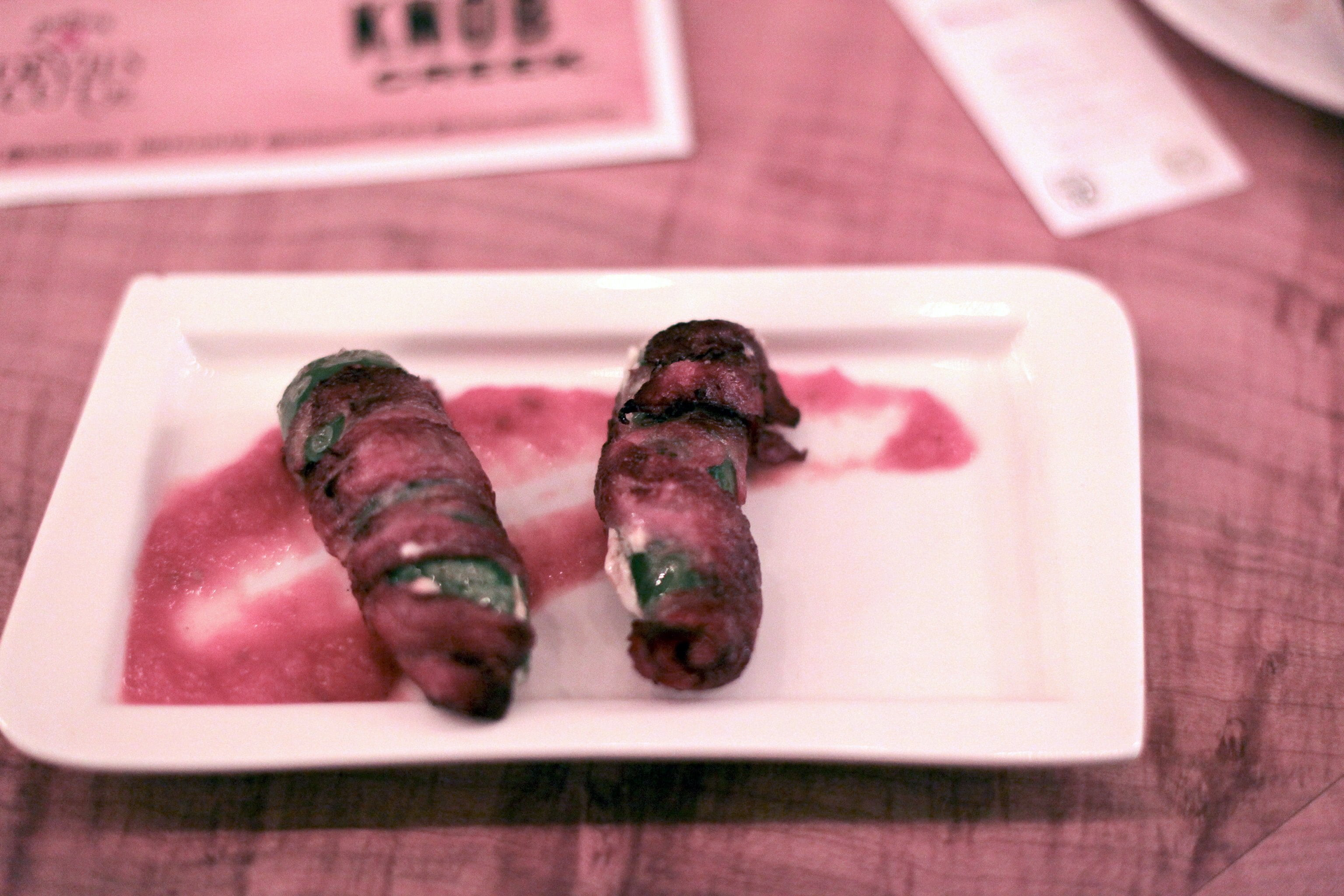Smoked bacon-wrapped jalapeños stuffed with aged cheddar Smoked bacon-wrapped jalapeños stuffed with aged cheddar